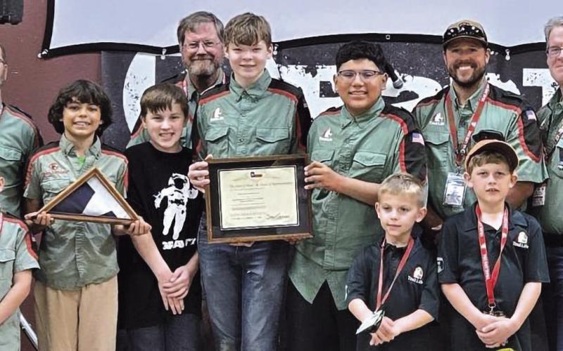 PRESENTATION—Texas House Rep. Stan Gerdes gave Trail Life Troop TX-1516 a Texas flag that was flown over the Texas Capital in honor of the troop. Included was a certificate that read in part, this flag “was flown at the Capital of the Sovereign State of Texas in recognition of your organization providing youth mentorship and character development.” Our local Rockdale Trail Life Troop is proud to have received this flag. We are very thankful to Rep. Gerdes for honoring us in this way,” said Pastor Steve Ammo