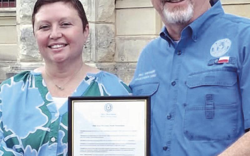 PROCLAMATION— Milam County Judge Bill Whitmire read declared April as Child Abuse Awareness Month on the courthouse lawn on Friday, April 17 at 9 a.m. Whitmire is shown here with CASA Executive Director Rachel Owens.