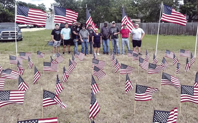 MEMORIAL DAY DISPLAY— In last week’s paper with graduation and the awards ceremony taking place a week earlier than usual, we didn’t have room for this photo of the beautiful Memorial Day Flag Display that is annually put on by the Rockdale VFW and American Legion. Shown here are members of Rockdale FFA and other volunteers making sure everything looks looked great to honor Milam County’s war dead. The Reporter hopes you were able to see it next to Rockdale Monument Co. Submitted photo