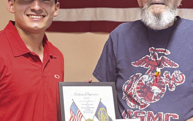 American Legion Carlyle Post 358 Commander Rod Stewart, right, feted Luke Olivares last Tuesday night with gifts and a scholarship as he makes his way to Austin's Texas Boys State and two military academies over the summer.