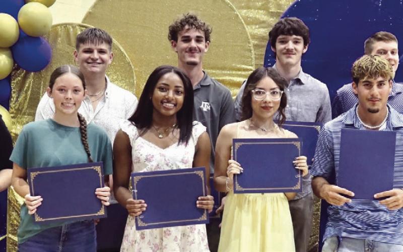 Rotary Scholarship winners (not in order) Brody Willard $2,000, Destinee Bluford $2,000, Blake Vance $1,000, Chase Nadeau $1,000, Alex Cooper $1,000, Emily Zientek $1,000, Jayden Davenport $1,000, Grace Patton $1,000, Aaliyah Aspilaire $1,000, Zarriah Arvizu $1,000 and Mason Lillard $1,000 with Macy Wages and Melissa Barchuch.