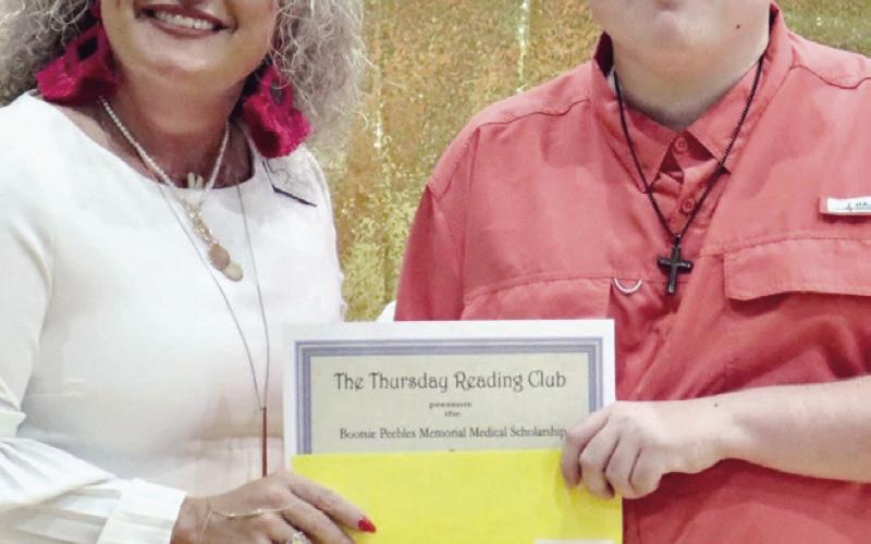 Thursday Reading Club winner Zach Karl with Wendy Mahan.