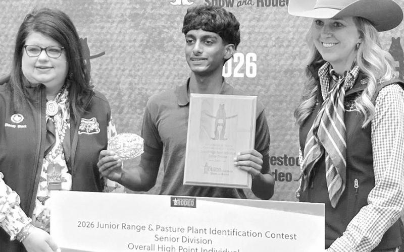 HLSR Plant ID Senior Individual Aaron Ponnaiya flanked by two HLSR representatives.