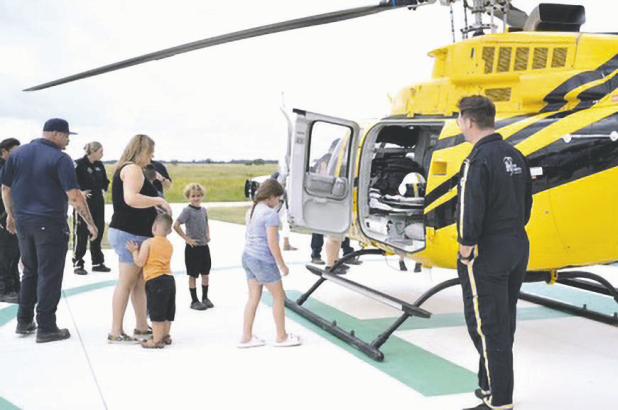 RIBBON CUTTING— Bartlett Volunteer Fire Department held a ribbon cutting for their new building and helicopter landing pad on August 16 at its Davilla location at 20759 FM 487. Attendees enjoyed a helicopter landing and got to climb inside.