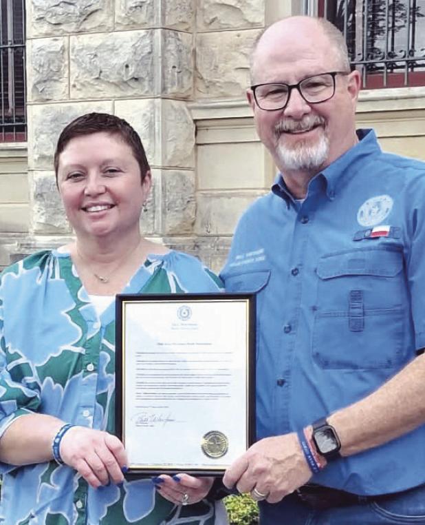 PROCLAMATION— Milam County Judge Bill Whitmire read declared April as Child Abuse Awareness Month on the courthouse lawn on Friday, April 17 at 9 a.m. Whitmire is shown here with CASA Executive Director Rachel Owens.