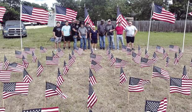 MEMORIAL DAY DISPLAY— In last week’s paper with graduation and the awards ceremony taking place a week earlier than usual, we didn’t have room for this photo of the beautiful Memorial Day Flag Display that is annually put on by the Rockdale VFW and American Legion. Shown here are members of Rockdale FFA and other volunteers making sure everything looks looked great to honor Milam County’s war dead. The Reporter hopes you were able to see it next to Rockdale Monument Co. Submitted photo