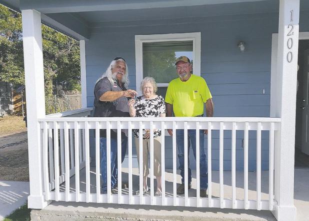 Houser receives the keys to new home with HOME program