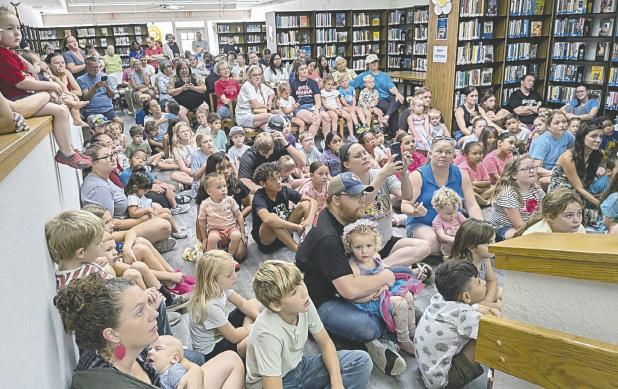 STANDING ROOM ONLY— Wild Things Zoofari was a huge success on Friday at the Lucy Hill Patterson Memorial Library as over 260 people packed the house to see lots of animals. Dylan McDaniel, who owns the animals, brought a red ruffed lemur, a chocolate skunk, a soft chinchilla, a tenrec from Madagascar, a Fennec fox and a 9-month-old kangaroo. All the kids got to pet the chinchilla and the kangaroo. See more photos on page 10A.