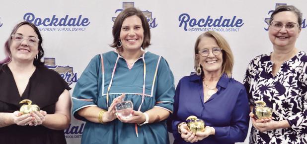 One teacher at each RISD campus was awarded a Teacher of the Year Golden Apple at the annual recognition banquet last Tuesday. Shown here are Taylor Grayson from Rockdale Intermediate School, Lauren Williams with Rockdale Elementary School, Lisa Debault from Rockdale High School and Lisa Laneer from Rockdale Junior High.