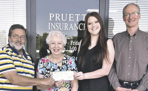 DONATION— Hochheim Prairie Farm Mutual Insurance Association donated $600 to MARC last Wednesday. On hand were (L-R) Eddie Dodd, Ann King, Ashley Crittenden and Mike Pruett.
