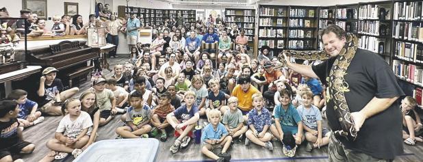 REPTILES!— Lucy Hill Patterson Memorial Library received a grant by the Texas Library Association and HEB for $2,000 for its Summer Reading Program as well as sponsoring Austin Reptile Shows with Michael Foux where about 150 kids of all ages got to learn about turtles, tortoises, legless lizards, bearded dragons and snakes from six different continents including a boa constrictor which they all got to pet.