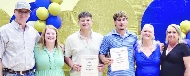 SCHOLARSHIPS— This year the Joe Wayne Cleveland Memorial Scholarships for $1,000 each went to Chase Nadeau and Brody Willard, shown here with Cleveland family members—(L-R) Kenny Cleveland, Shellea Griner, Sarah Cleveland and Nikki Kirk. See more photos from last Wednesday’s Rockdale High School award ceremony on page 6B.
