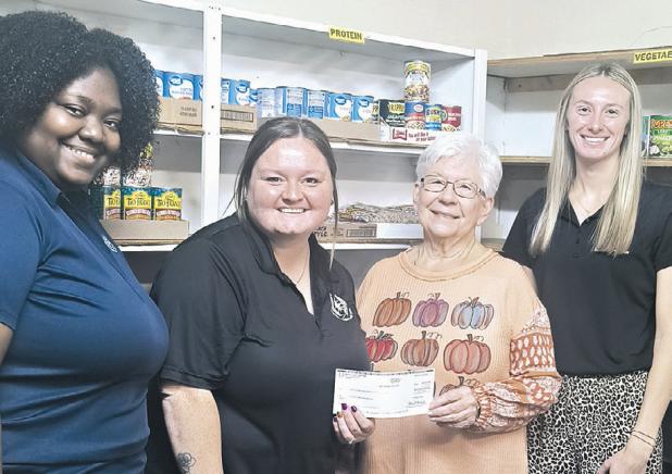 DONATION— Rockdale Federal Credit Union made holiday donations to both the Rockdale Christian Services food pantry and Rockdale Senior Center last week. Shown here at the food pantry are RFCU employees Nygia Crawford, Samantha Wilson, food pantry treasurer Joyce Kirk and Lyndsey Kolar.