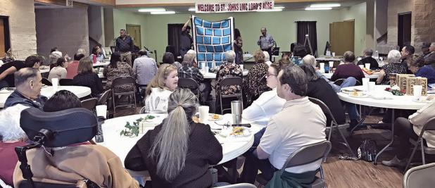 FUN TIMES— St. John’s United Methodist Church held their annual fundraiser, Lord’s Acre, on Sunday after church with a meal cooked by the Methodist Men. There was both a live and a silent auction. Auctioneer John Fisher has volunteered his services every year since the fundraiser started in 1997. This year the church raised $22,000 auctioning paintings, Christmas décor, trips, baked goods, dinners, jewelry and more.