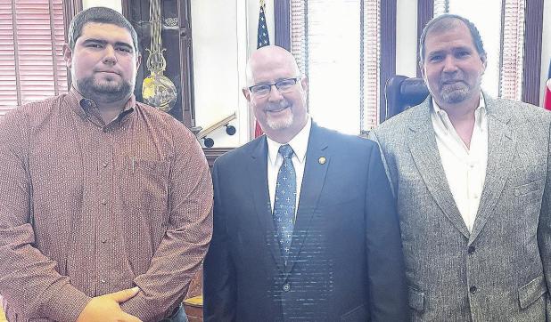 Judge, commissioners take office