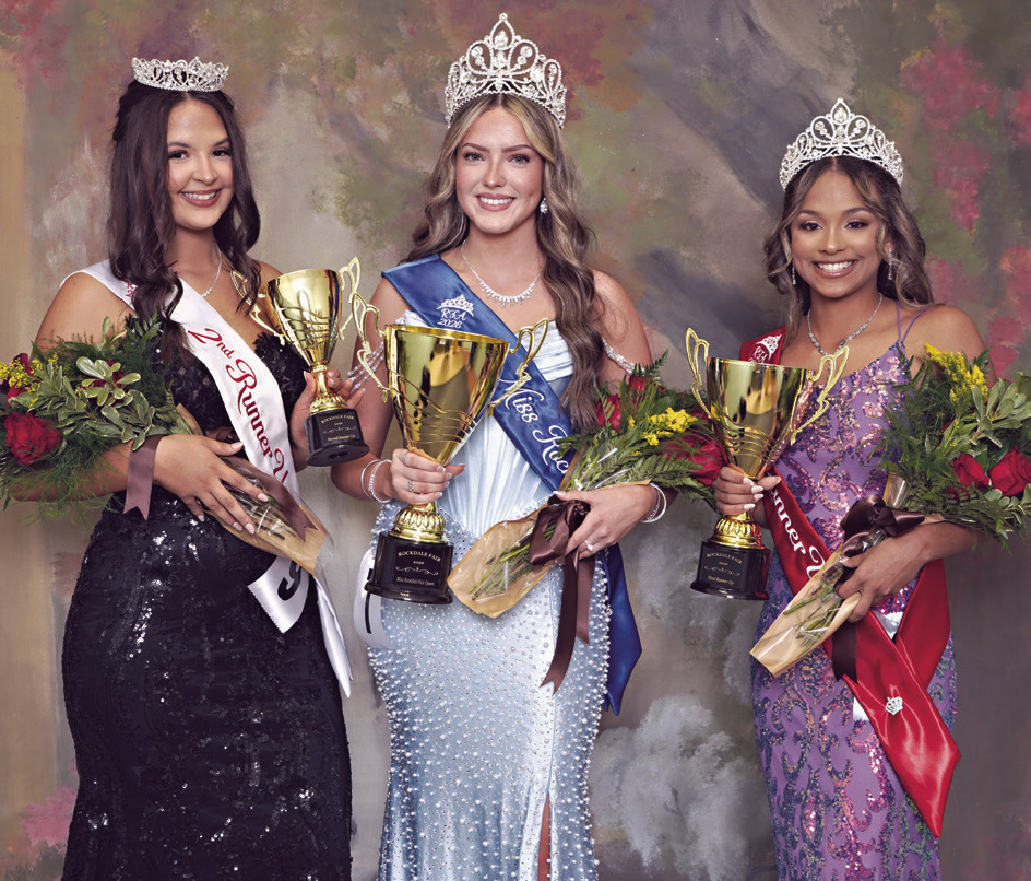 FAIR ROYALTY— Addisyn Lunsford, center, was crowned Miss Rockdale Fair Queen on Saturday night at the annual pageant held in the RHS auditorium. She is sponsored by Whiteley’s Farm Supply. First runner-up is Jazzlynn Dixon (R) sponsored by Caffey Corner, and second runner-up (L) is Becca Thomas sponsored by M&amp;G Designs Boutique. See the children’s pageant winners on page 6A. Photo courtesy of Jocelyn Lewis at Rockdale Signs &amp; Photography