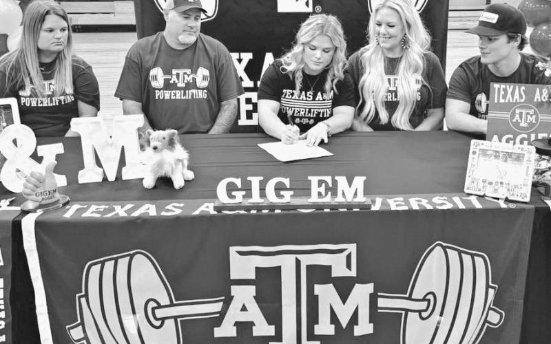 POWER SIGNING— Thorndale senior Jordyn Stutts signed with Texas A&amp;amp;M University last week in Thorndale High School gym to continue her powerlifting career for the Aggies. Last month Stutts became a three-time state champion for the Lady Bulldogs, setting three state records in the process. Thorndale ISD Athletics photo