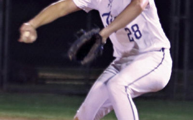 Reporter/Nathan Flores At left, Tiger Slayde Harris pitching for Rockdale Tigers on Friday night against the Yoe. Harris relief pitching for the Tigers. At right, Lady Tiger Emma Miller received congratulations