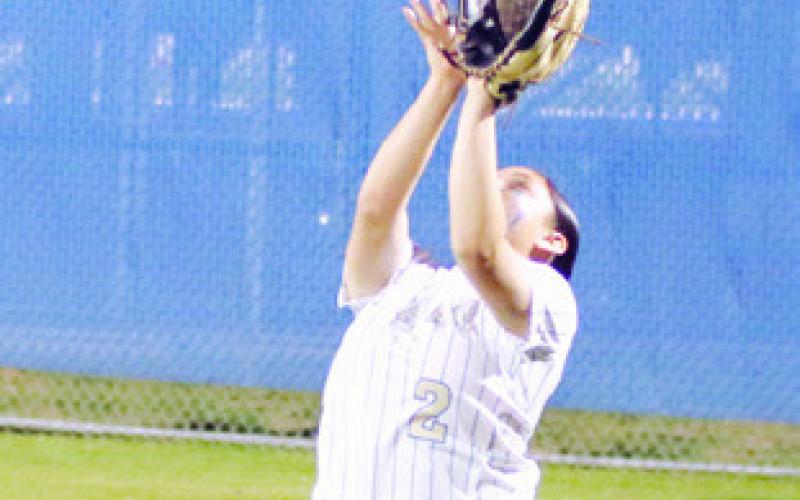 Lady Tiger Janaya De La Garza catches a fly ball against the Rogers Lady Eagles last week at Tiger Field. Reporter/Nathan Flores