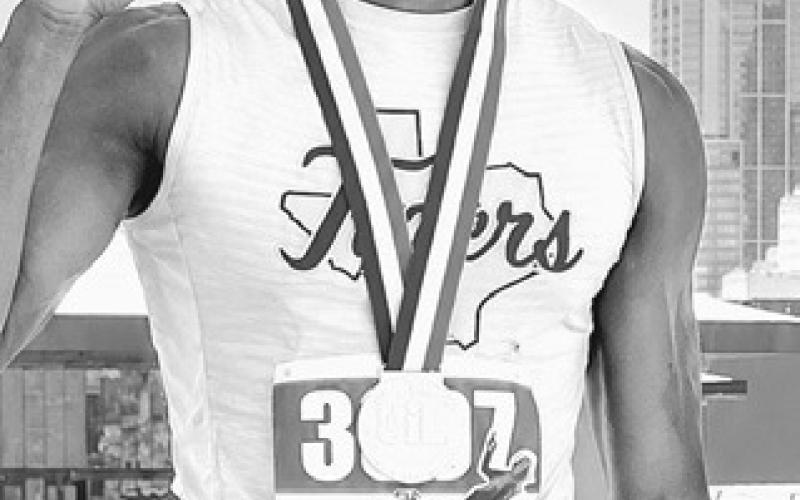 Rockdale Tigers Athletics photo RHS senior De’Andre Stephens receiving his gold medal Thursday at the State Track Meet in Austin.