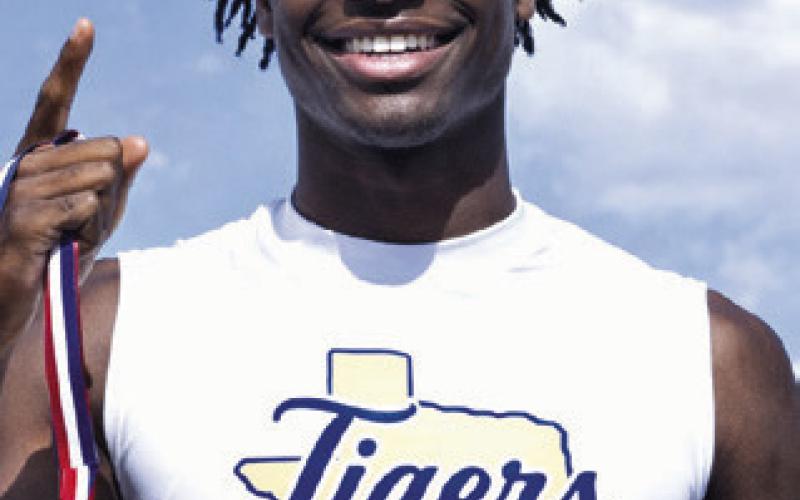 Tigers Jon Fuller (L) and Dre Stephens (R) were district champions in two events each and will advance to area competition. Fuller was first in the 1600 and 3200 runs, while Stephens was tops in the high jump and triple jump. Rockdale Tigers Athletics photos