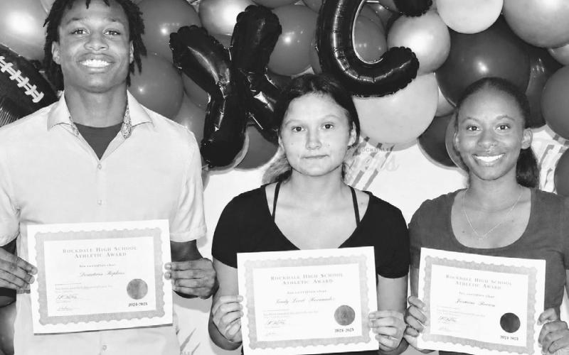 The Rockdale High School Outstanding Male Athlete of the Year was De’Andre Stephens (L), while Hannah Mckie (center) and Trinity Hurd shared the Outstanding Female Athlete of the Year award at the recent RHS Athletic Banquet. Photo by Morgan Hamrick