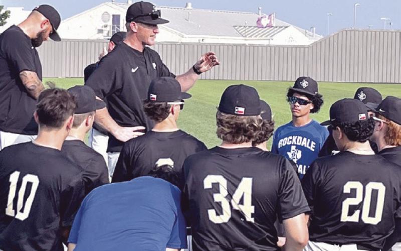 Above, the 2026 Rockdale Tigers are playoff bound and will face the Groesbeck Goats in a bestof- three series starting Wednesday. At right, Rockdale Coach Austin Caffey addresses the team after winning Saturday’s tie-breaker game that propelled the Tigers into the postseason. Rockdale Tigers Athletics photos