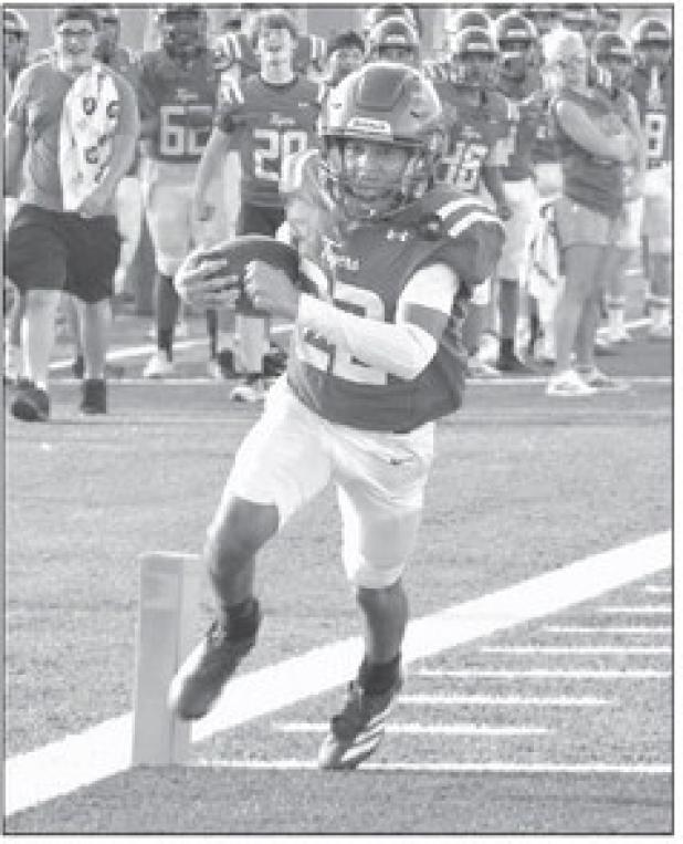 JV Tiger LaQuinten Jackson (22), a freshman, rumbles into the end zone Thursday against the Rogers Eagles JV. Rockdale won the game 42-16. Reporter/Nathan Flores