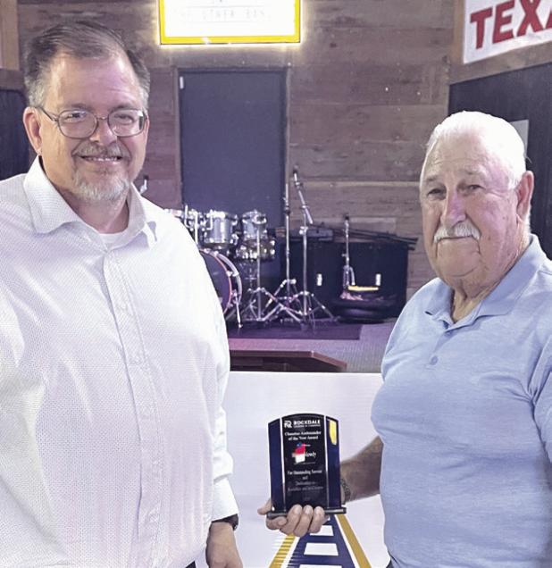 Homer Mowdy accepts Chamber Ambassador of the Year from Tim Kelty.