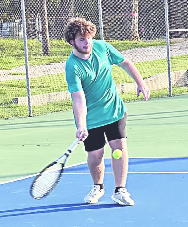 Tiger varsity tennis player Tyler Roberts hit the court last week in the heat for some summer fun and practice. Reporter/Ken Ansell