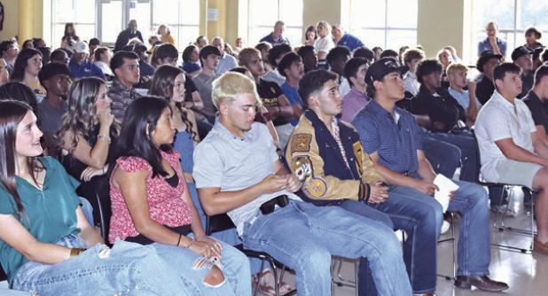 Above, Rockdale student athletes wait to hear their name called during last week’s athletic banquet. At right, Rockdale Athletic Director/Head Football Coach Hunter Hamrick speaking at the banquet. A full list of award winners will be available in next week’s Reporter. Rockdale Tigers Athletics photos