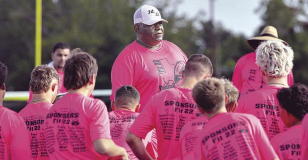 Coach Deron Clay addresses campers before drills begin during Saturday’s annual Fit 22 Football Camp at Tiger Stadium in Rockdale. Participants spent the day working through drills and receiving instruction designed to prepare them for the upcoming football season. Coaches from across Texas provided instruction throughout the day, and the camp concluded with awards recognizing outstanding campers. Photo by Kells Image