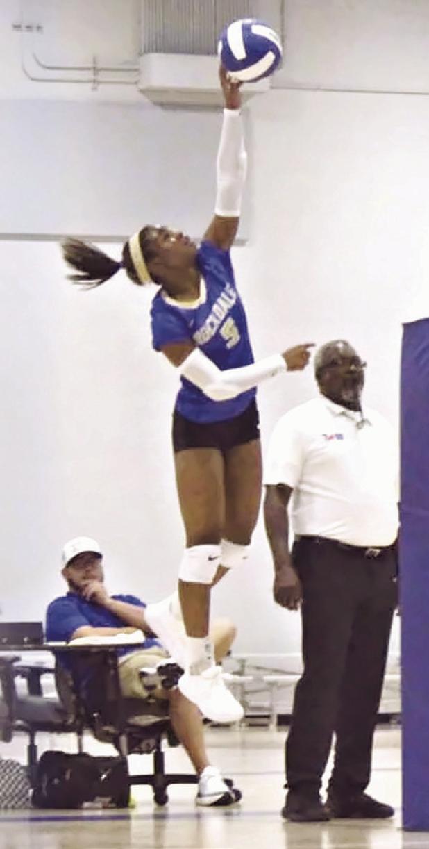 Rockdale’s Chloe Miles rises for an attack during recent action. The Lady Tigers placed fourth in the Rockdale Volleyball Tournament, narrowly falling to Florence in three sets in the third-place match. Rockdale Tigers Athletics photo