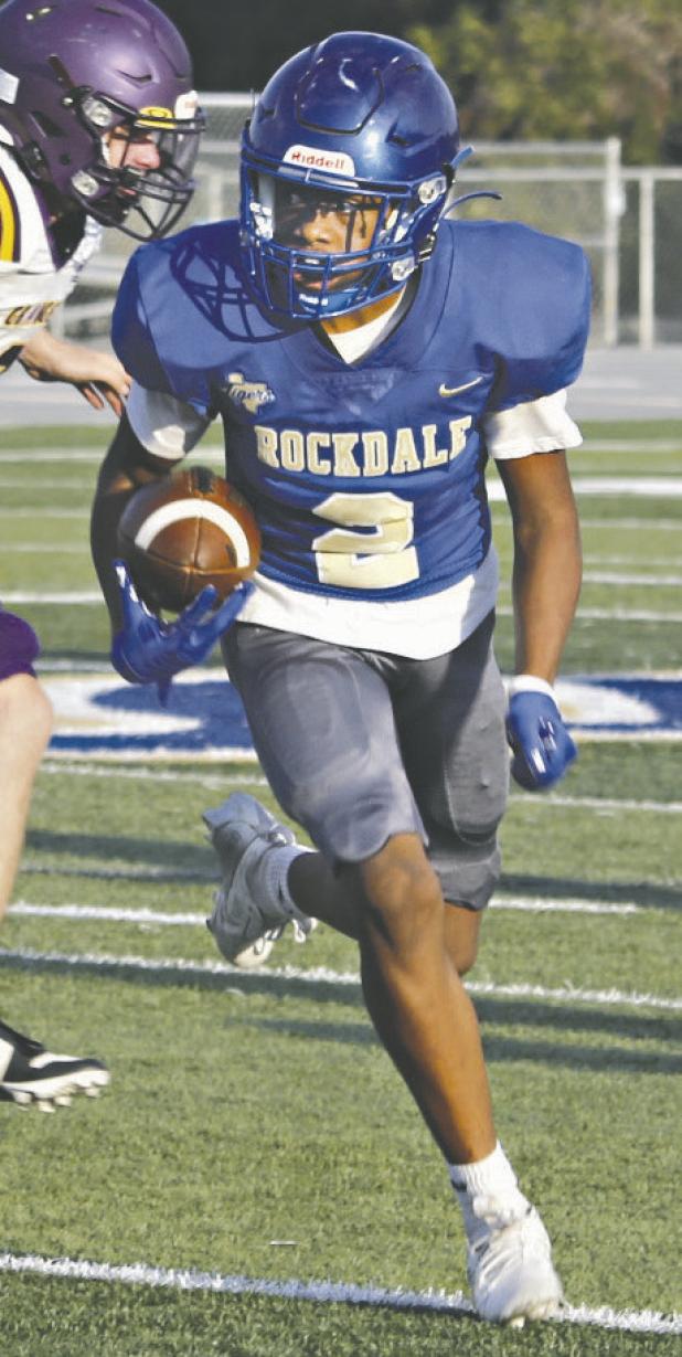 King Knox of the Rockdale JV Tigers looks down field for the end zone on Thursday against the Granger Lions JV. Knox had two touchdowns— one rushing and one receiving. Reporter/ Nathan Flores