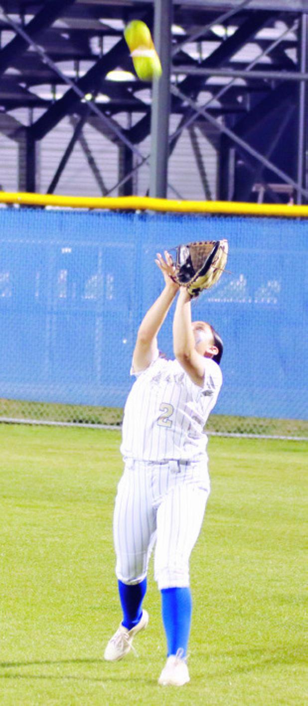Lady Tiger Janaya De La Garza catches a fly ball against the Rogers Lady Eagles last week at Tiger Field. Reporter/Nathan Flores