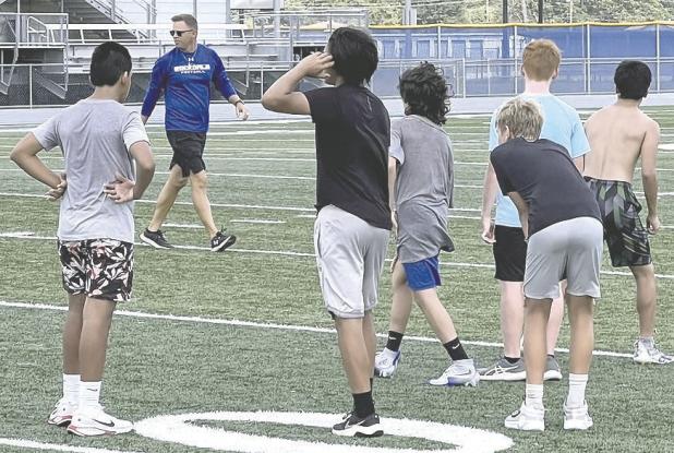 Student-athletes receive instructions from Rockdale High School head football coach Hunter Hamrick in last week’s final summer strength and conditioning program. Reporter/Ken Ansell