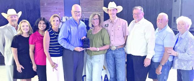 The Rockdale Rotary Club received the Community Impact Award. Here are (L-R) Steve Laukhuf, Leslie Davidson, Melissa Barchuch, Gaye Bland, Terry Richter, Sandy Langwell, Braden Wallis, Tim Kelty, Homer Mowdy and Barbara McWhirter.