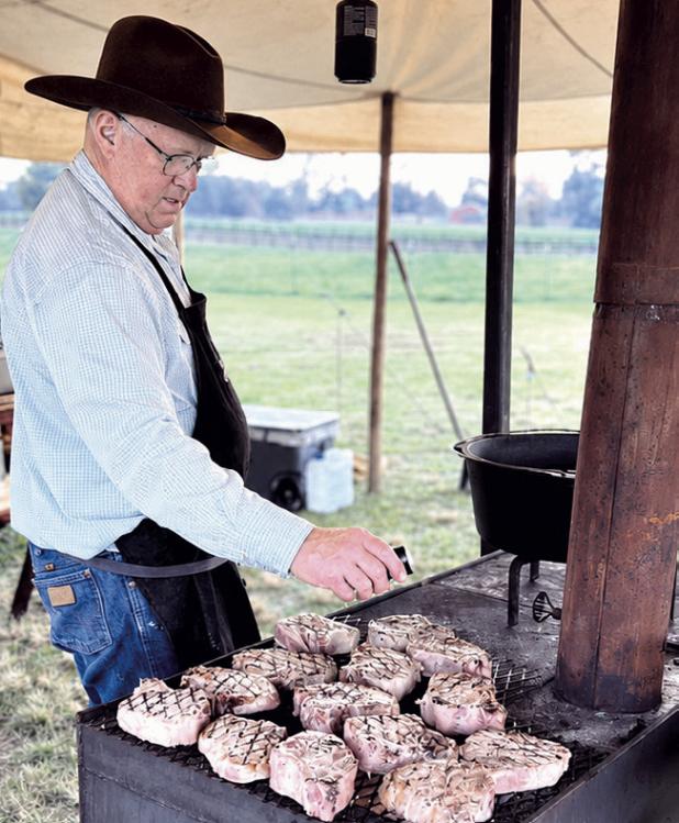 Jeffrey Mueller cooking in his chuckwagon.
