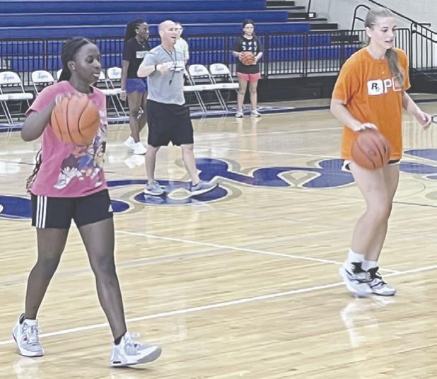 New girls basketball Coach Young has girls working on skills at summer strength and conditioning sessions. Reporter/Ken Ansell