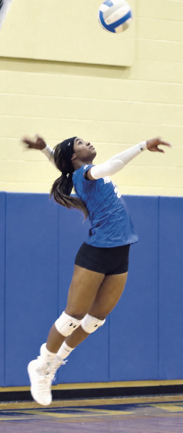 Rockdale Lady Tiger Chloe Miles serving against Academy on Friday in Tiger Gym. Miles led the Lady Tigers with seven digs, four kills and five assists. Rockdale lost to Academy in three straight sets— 10-25, 17-25 and 11-25. Reporter photo by Nathan Flores