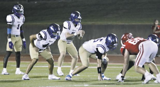 Tiger quarterback Greyson Williams (7) prepares for the snap with running back Jeremiah Butler (1) lined up in the backfield Friday night in Groesbeck Stadium. Luke Olivares (44), as well as the rest of the Rockdale line, are set to block on the play. The Tiger offense produced a total of 541 yards against the Goats, with Williams accounting for 425 through the air. Reporter/ Nathan Flores