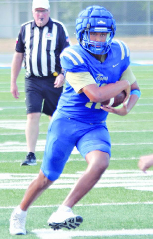 JV Tiger Bentley Jones gets loose against the Buffaloes Thursday evening. Reporter/Nathan Flores