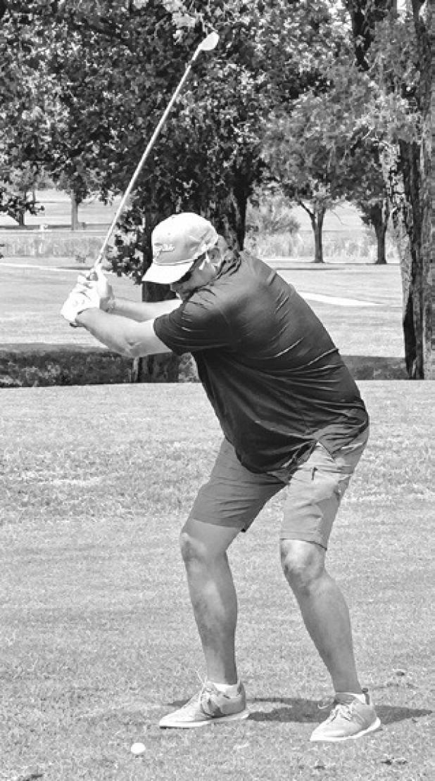 Rockdale Tiger Booster Club President tees off on hole 6 at the Rockdale Country Club during the annual booster club tournament. Reporter/Nathan Flores