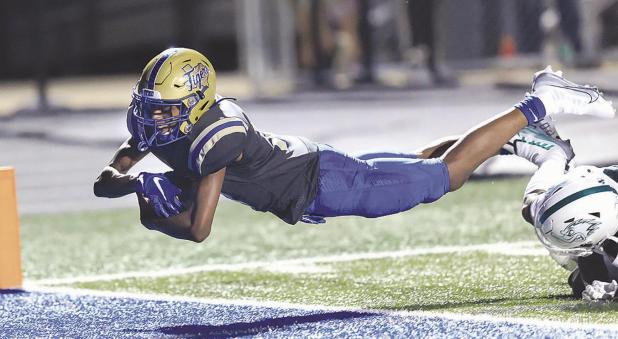 Taylor tops Tigers in high-scoring affair, 55-41