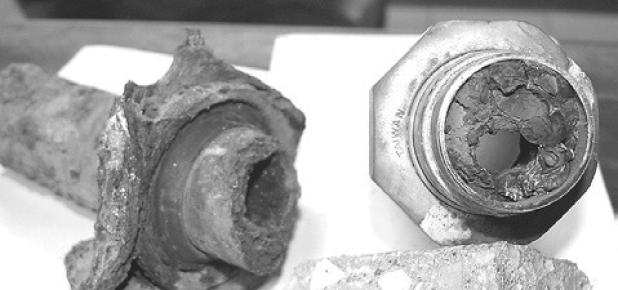 Cast iron water pipes excavated in 2016 shows mineral buildup. — File photo