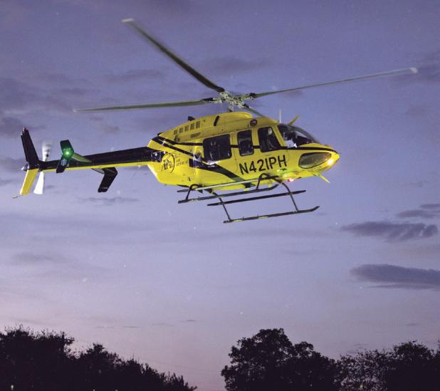 SALUTING FIRST RESPONDERS— PHI Air Ambulance Network delivered the game ball Friday night at the Tigers vs. Rogers Eagles’ game at Merk Field in tribute to the 9/11 first responders. See more in Sports starting on page 1B. Photo by Steve Young