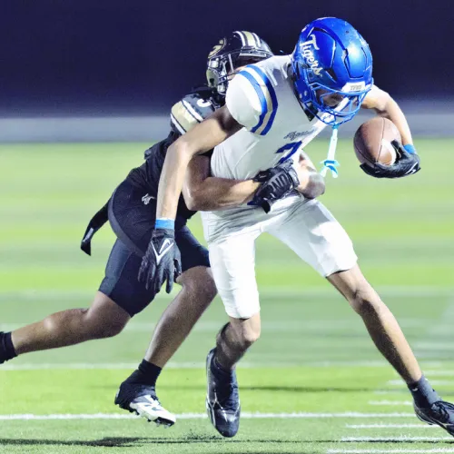 Tiger receiver Jon Fuller hauls in a pass on Friday night against the Giddings’ defense. Fuller had the lone Tiger touchdown on Friday night. Photo by Steve Young