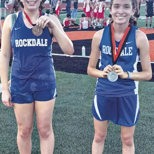 TOP THREE— Rockdale eighth-grade runners Nora McMannus, left, and Paulina Waak turned in strong performances at the Smithville Junior High Invitational last Wednesday. Waak placed second and McMannus finished third among more than 115 runners. Rockdale Tigers Athletics photo