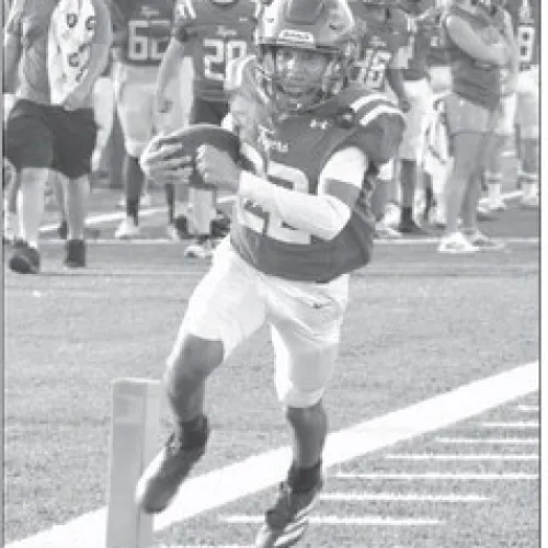 JV Tiger LaQuinten Jackson (22), a freshman, rumbles into the end zone Thursday against the Rogers Eagles JV. Rockdale won the game 42-16. Reporter/Nathan Flores