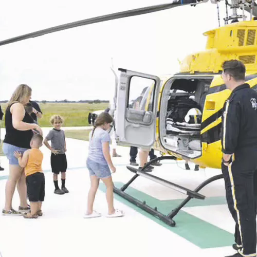 RIBBON CUTTING— Bartlett Volunteer Fire Department held a ribbon cutting for their new building and helicopter landing pad on August 16 at its Davilla location at 20759 FM 487. Attendees enjoyed a helicopter landing and got to climb inside.